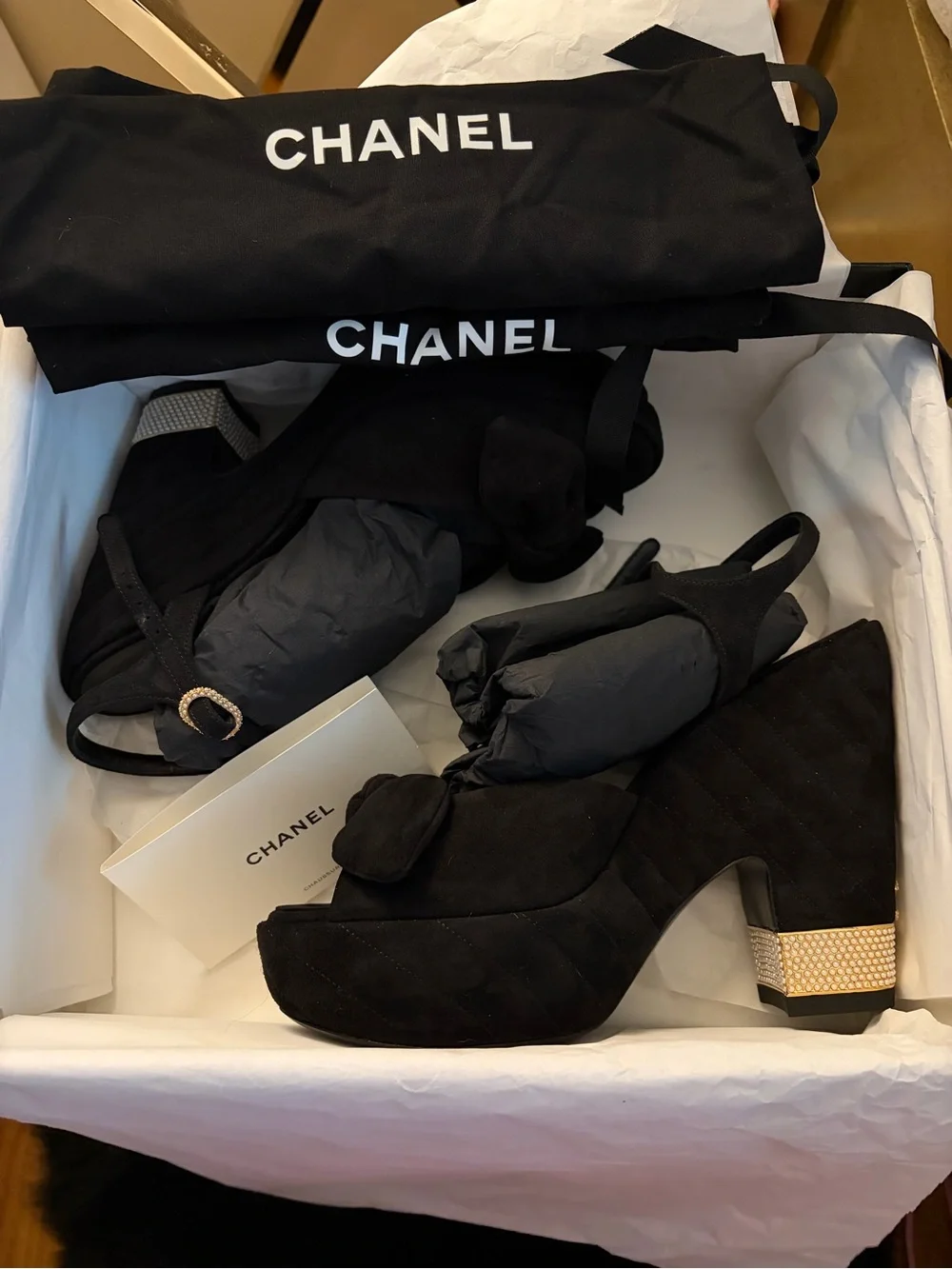 CHANEL Black Suede Platform Sandals with Bow and Pearl Heel Accent
